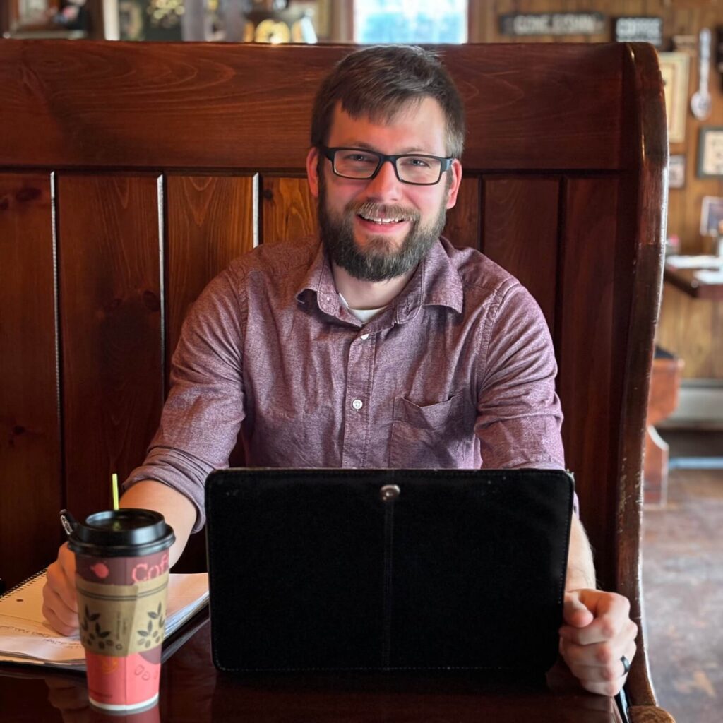 DFDA00CE-65D9-4E42-8C2F-4FDC21A5DB8A_1_102_o Wesley Gehman Internet marketer sitting at a coffee shop in Orwigsburg, PA.